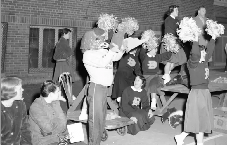 black and white image of original ellsworth mascot cheering