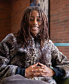 Student sitting in on a couch in the Seymour Union