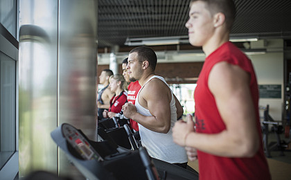 People running and walking on treadmills in the Fitness Center