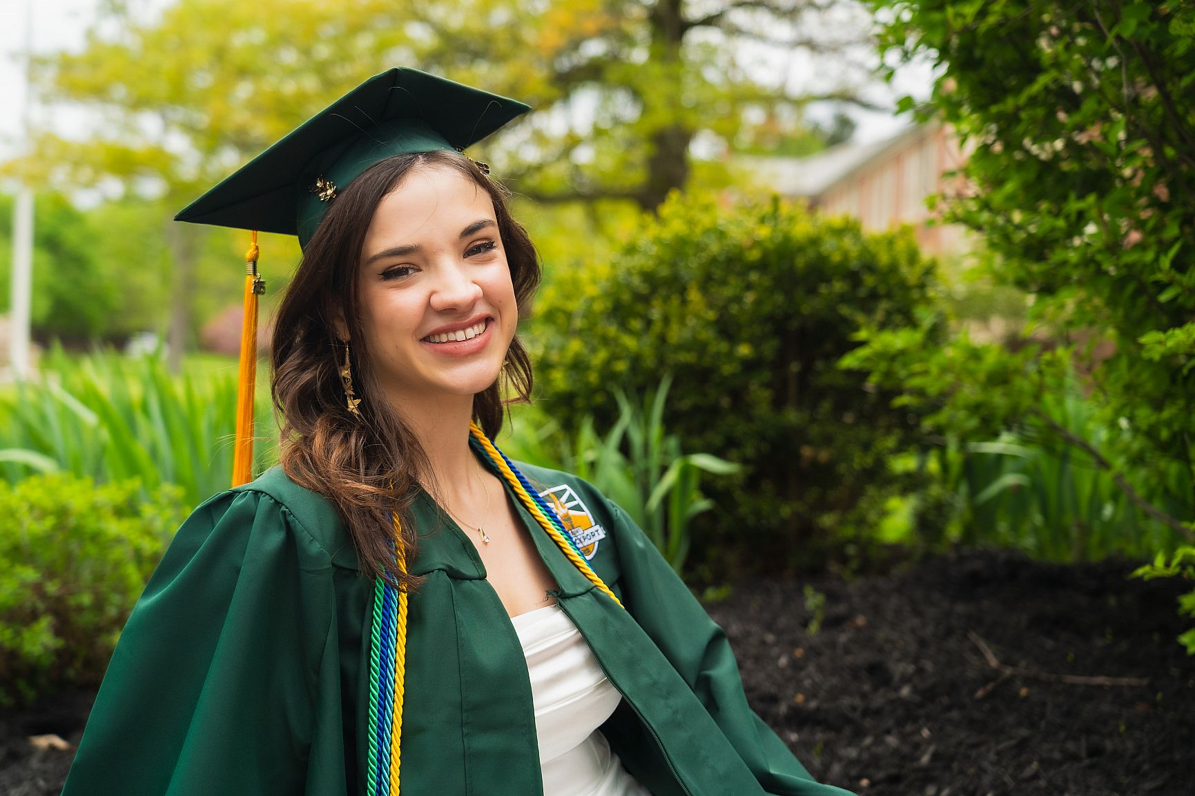 hailey jones poses in cap and gown