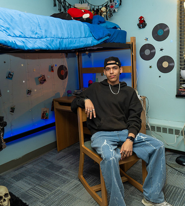 Enfry sitting in his dorm room