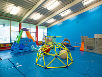 Indoor climbing toys on a blue mat