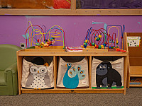 Maze style toys and bags inside of a classroom