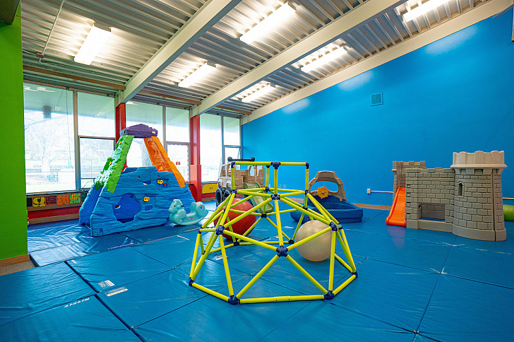 Indoor climbing toys on a blue mat