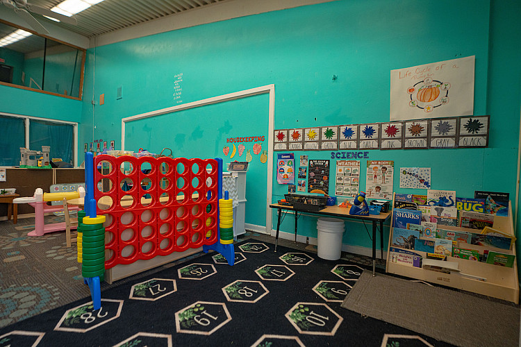A big connect four and other toys in a classroom
