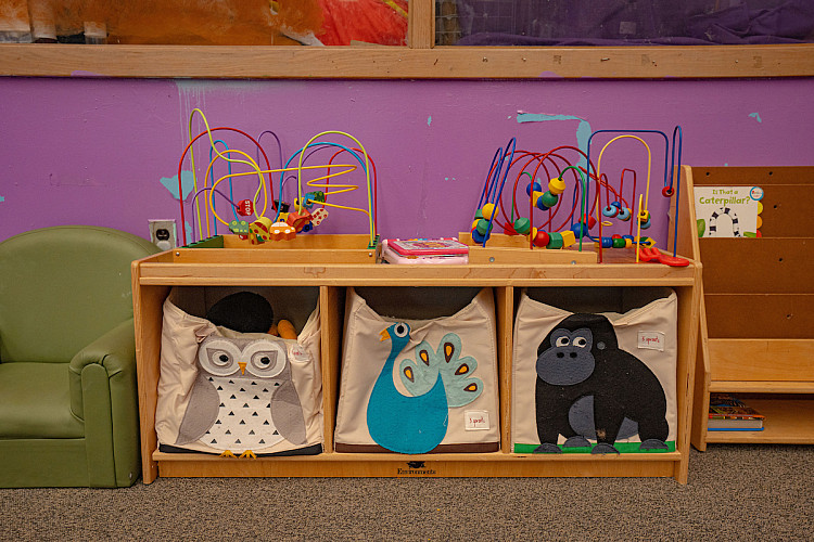 Maze style toys and bags inside of a classroom