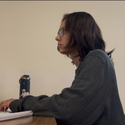 Elizabeth Kuhlkin at a desk typing on a computer
