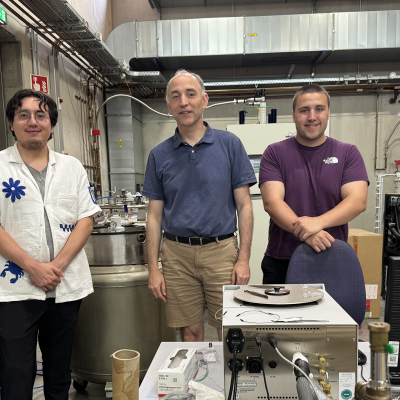 David Sanchez with a professor and Caleb Janikas in a lab with pressurized containers