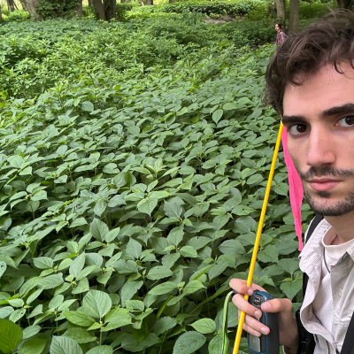 Selfie of Nick Sitterly in a field of wild plants