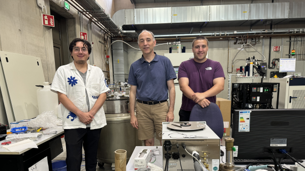 David Sanchez with a professor and Caleb Janikas in a lab with pressurized containers