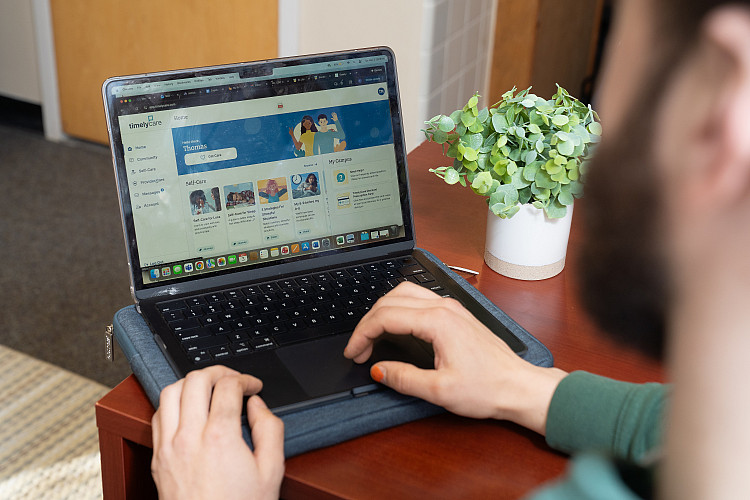 person using TimelyCare site on their laptop