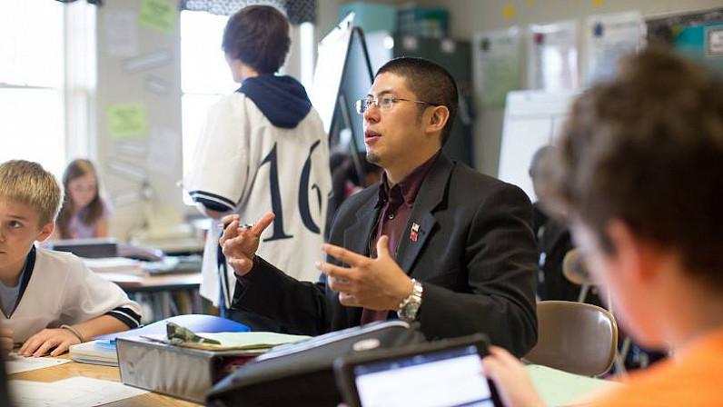 Student teacher talking to a student