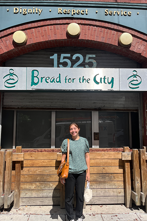 Leah Siegmann standing outside the entrance to Bread for the City, where she interned.