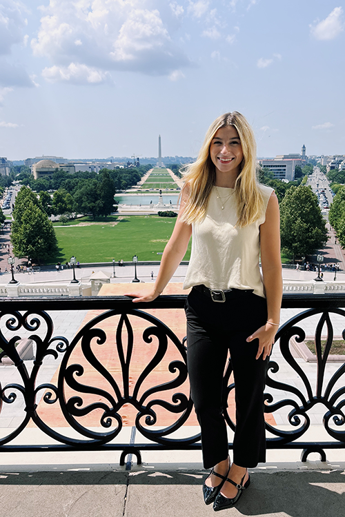 Sophia Cook standing on the Speaker's Gallery inside the U.S. Capitol.