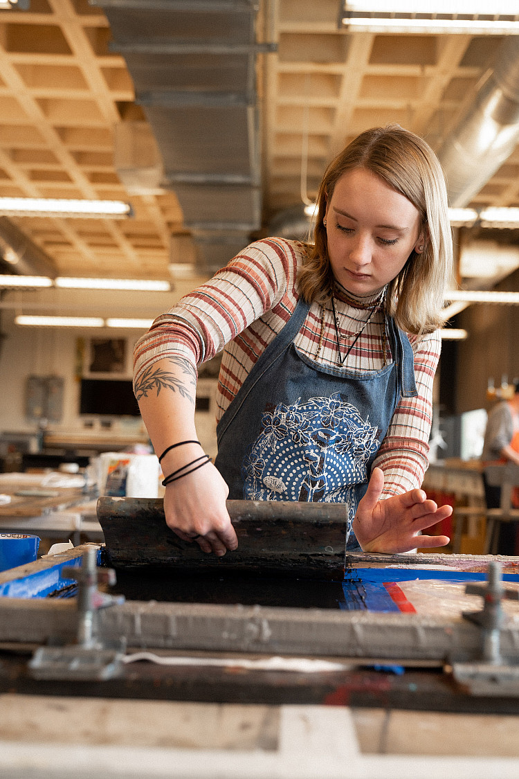 Students in the Art-Studio program learn to transfer designs onto posters, t-shirts, and more through the art of screenprinting.