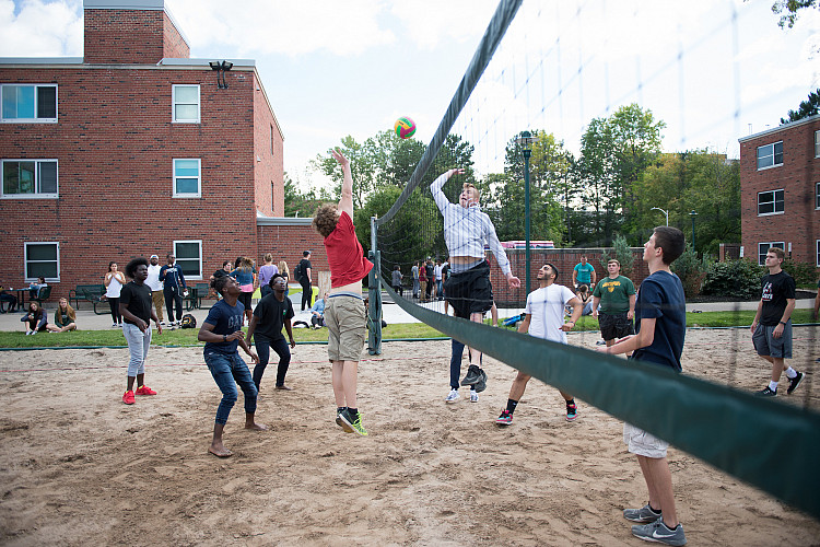 students playing volleyball in the freshman quad