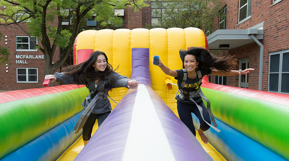 two girls racing on an inflatable game