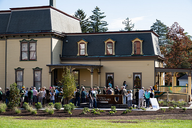 Crowd of people outside Alumni House