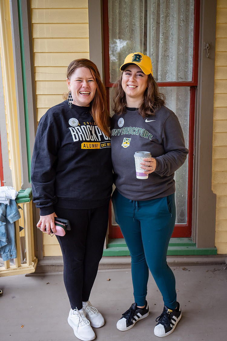 Two women standing on porch