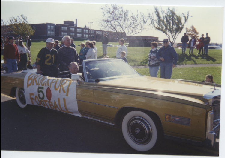 Car driving in Homecoming parade.