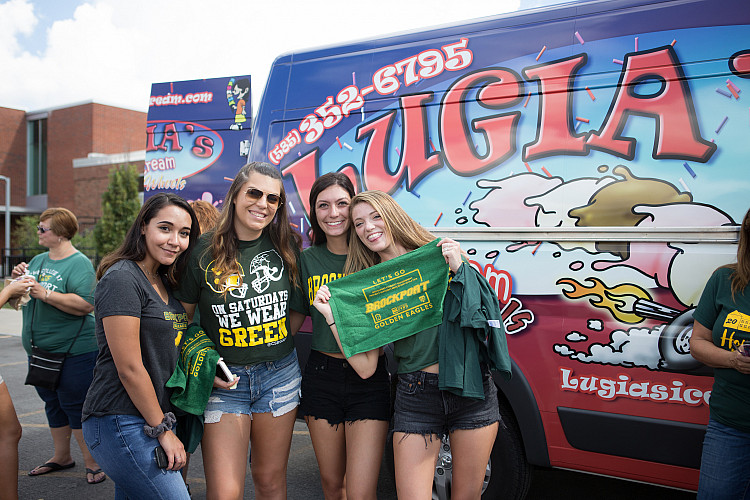 Four alums at Homecoming.