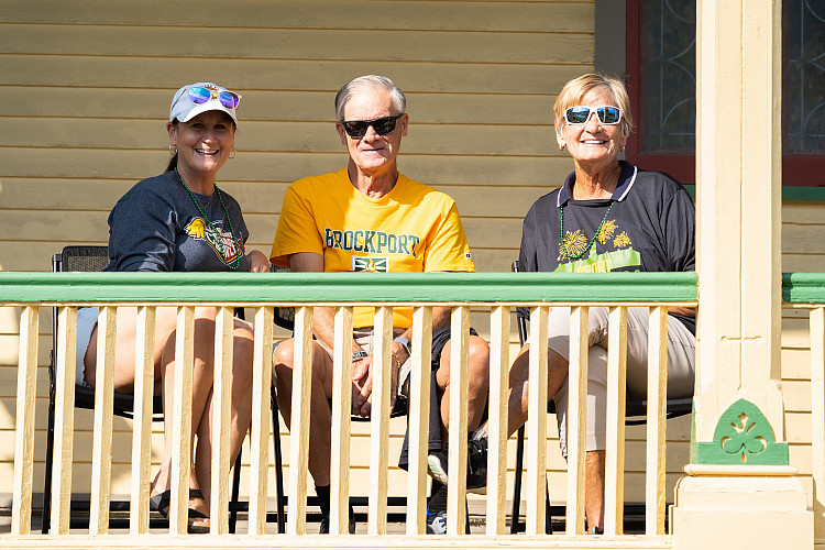 Three Brockport alums sitting on porch.