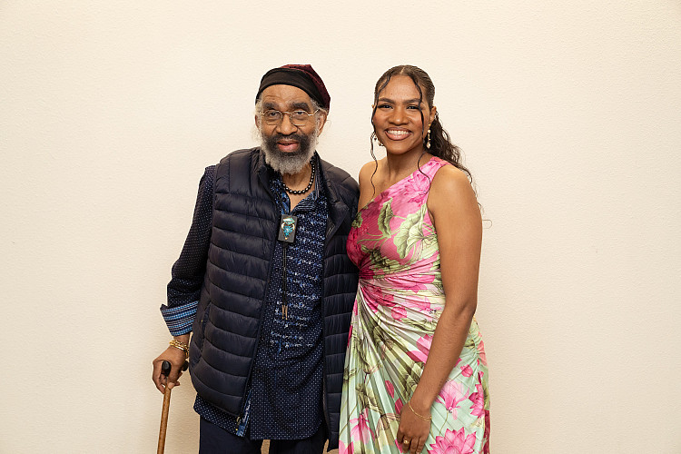 Brockport student standing with Garth Fagan.