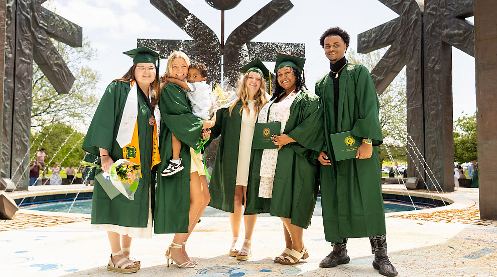 Group of Brockport graduates in front of Special Olympics Fountain.