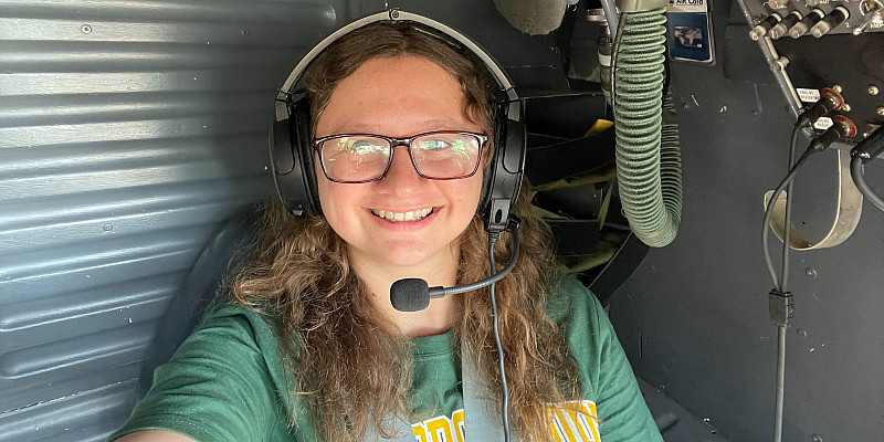 Hutton poses inside a NASA aircraft as part of summer internship program