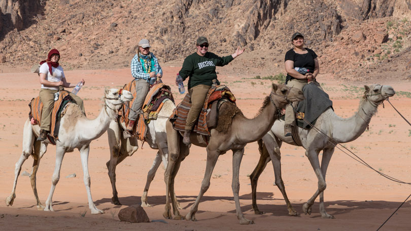 4 people on camels