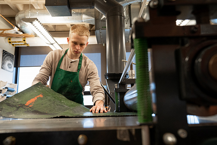 student working in a printing press
