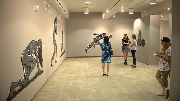 students viewing the gallery