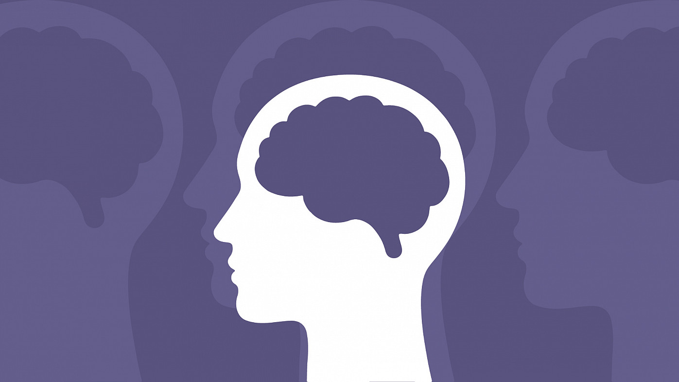 graphic of a head with a brain inside of it over a purple background
