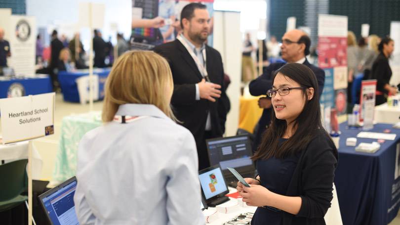 Student talking to an employer at an event