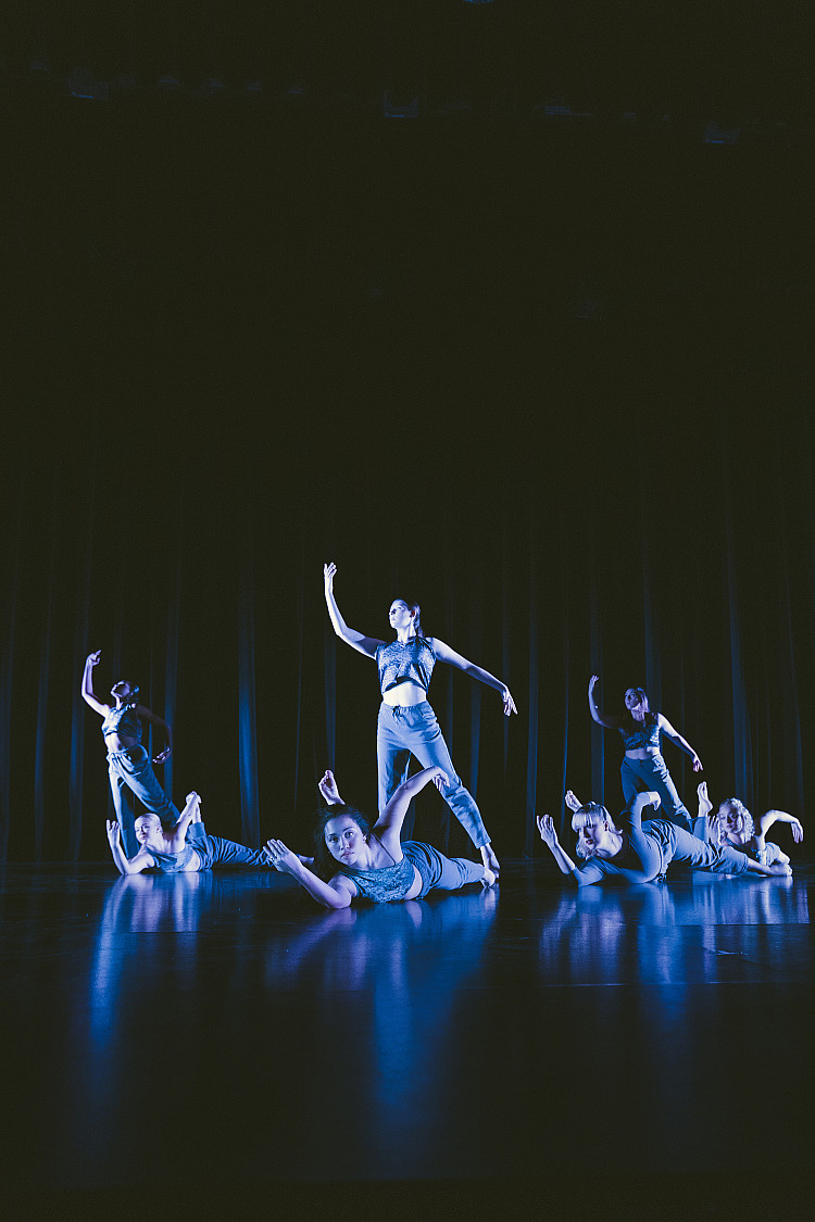 Students dancing standing up and laying on the floor