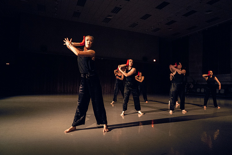 Students dancing in black clothes