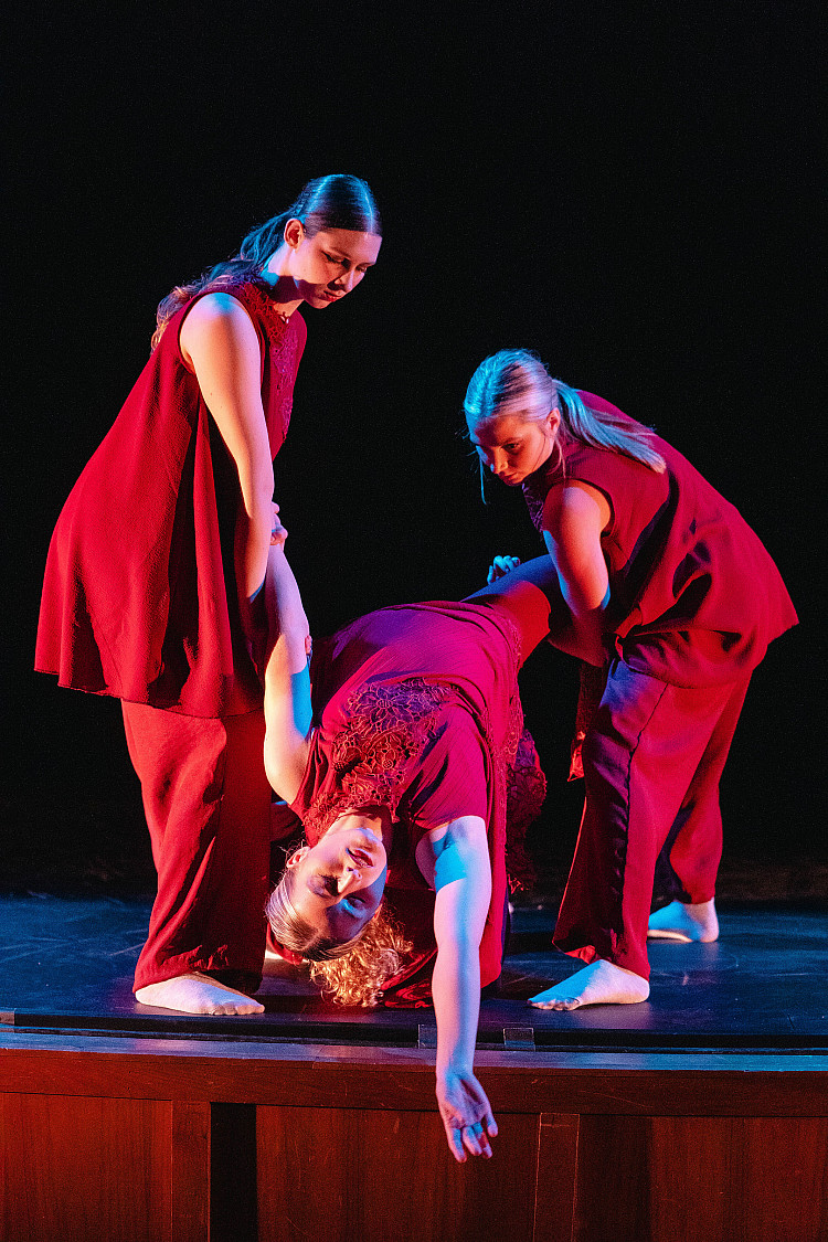 Three students performing in Danscore on campus