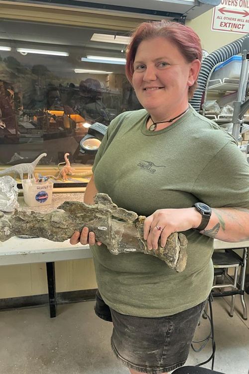 Alysha Zazubec showing off a fossil