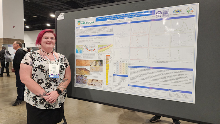 Alysha Zazubec standing next to a presentation board at the Geological Society of America Meeting