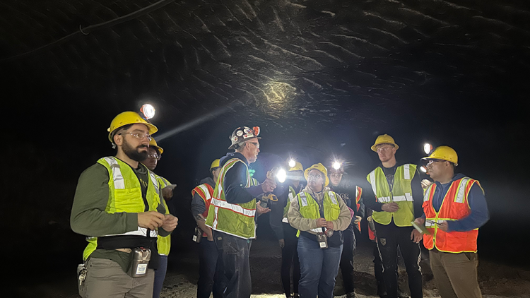 Earth Science students wearing hard hats and safety gear in a salt mine