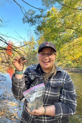 Earth Science student showing off a rock