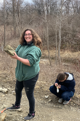 Geology students showing off rocks they've collected
