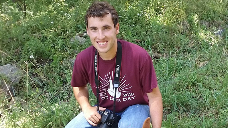 Jacob Kearney in the woods with a camera