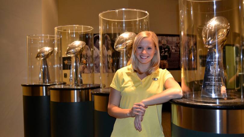 Alumni at the Green Bay Packers facility with their multiple Lombardi Trophies