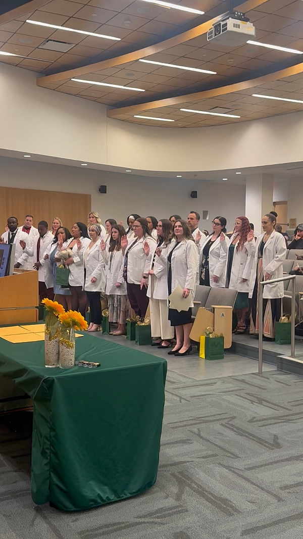 22 FNP graduates reciting the Nightengale Pledge during the 1st annual White Coat Ceremony