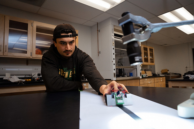Student working on Mars Rover robot