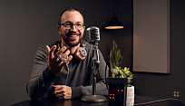professor Kyle Green records a podcast in photo studio