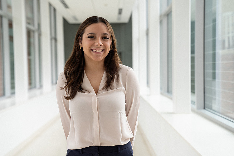 Student smiling at the camera