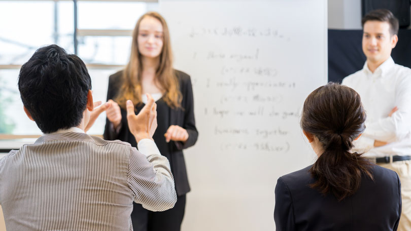 Students taking business advice from professionals