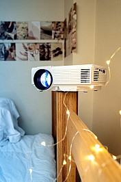 projector set up on bed frame